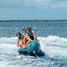 jobe-chaser-4-person-towable-ski-tube-teal-orange-riders-on-water-6