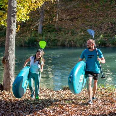 jobe-loa-11-6-sup-paddleboard-lime-couple-carrying-sups-in-forest